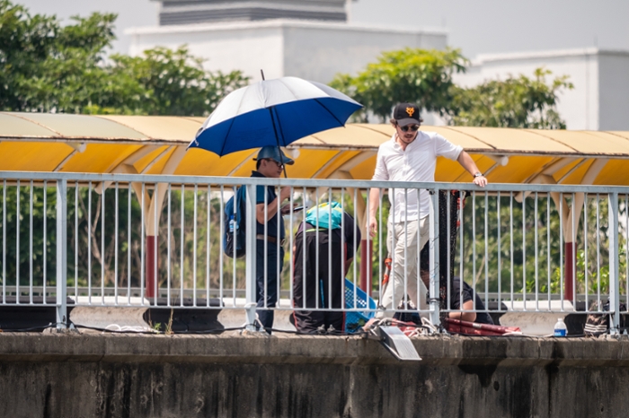 Van Emmerik trawling a Malaysian river as part of a pollution study project