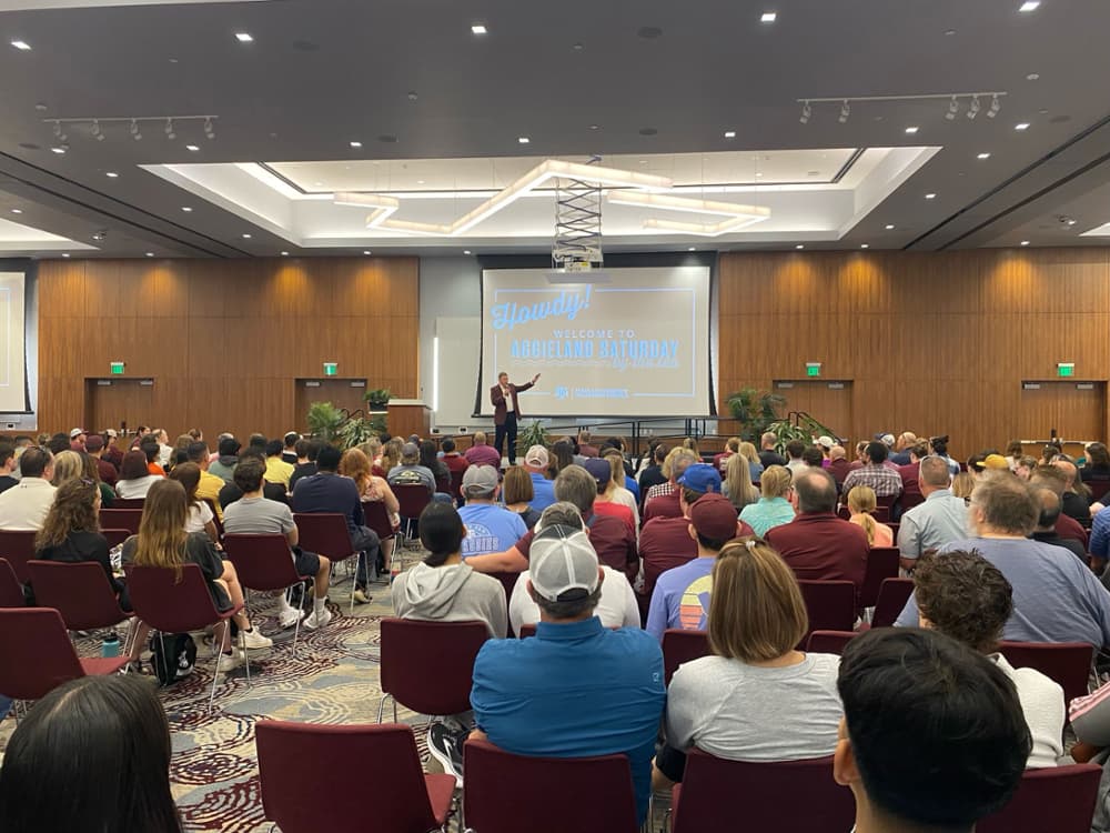 Prospective students and guests looking forward at a presentation at Aggieland Saturday by the Sea