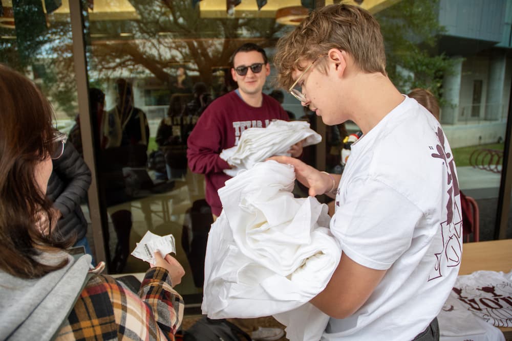 Students discuss an on-campus vote center