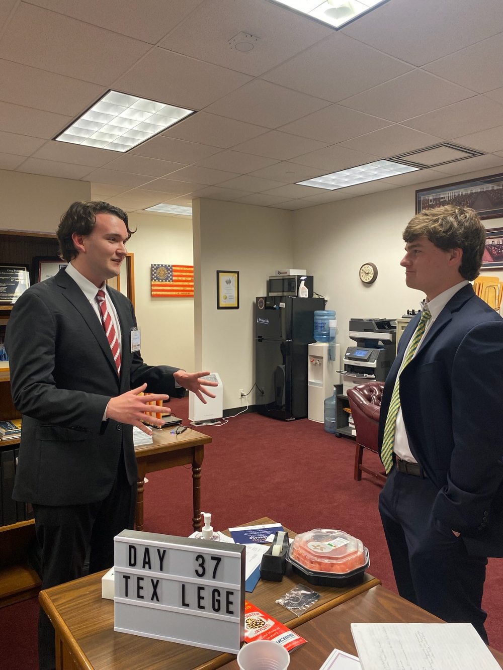 Student Ashton Whittington speaks to a legislative staffer during Orange and Maroon Legislative Day